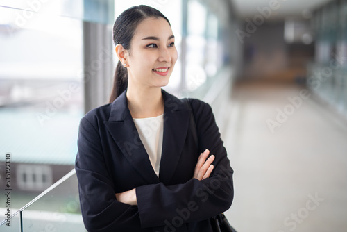 Asian business woman smiling looking away, Fashion business photo of beautiful girl in casual suite .