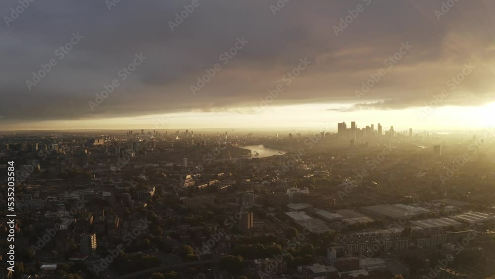 Sunrise looking over the Thames river, London with skyline and city below Sunrise looking over the Thames river, London with skyline and city below
