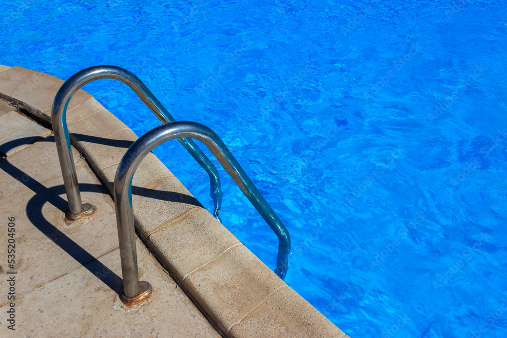 Swimming pool with clear water at a tropical resort Swimming pool with clear water at a tropical resort