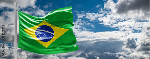 The flag of Brazil flutters in the wind in the center of the flag with the words order and progress Brazil election: ex-president Luiz Inácio Lula da Silva to face Jair Bolsonaro in runoff photo