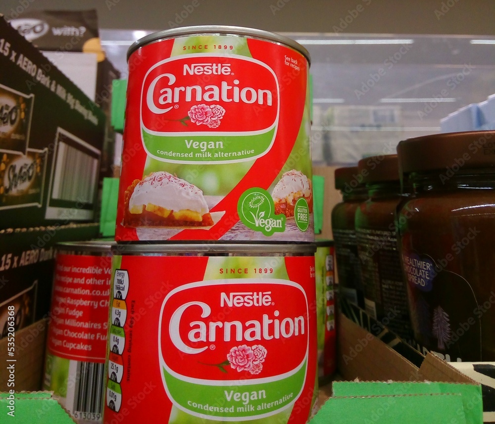 Vegan condensed milk alternative by Carnation, and trademark logo