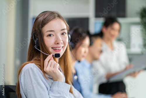 Portrait of Caucasian young business woman call center work in office.