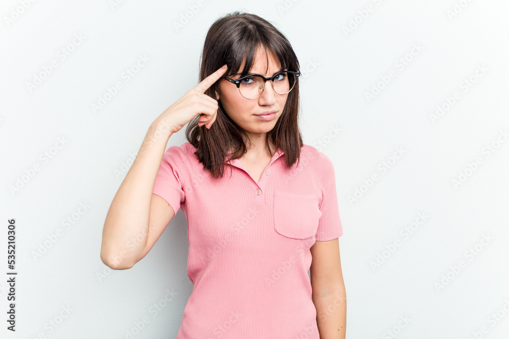 Young caucasian woman isolated on white background pointing temple with finger, thinking, focused on a task.