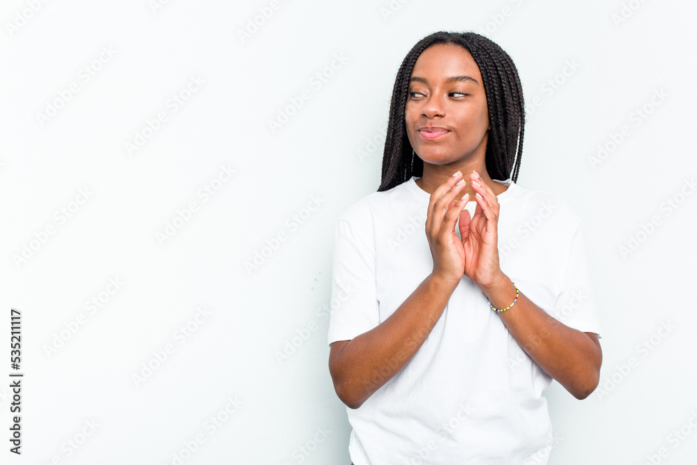 Young African American woman isolated on white background making up plan in mind, setting up an idea. Young African American woman isolated on white background making up plan in mind, setting up an idea.