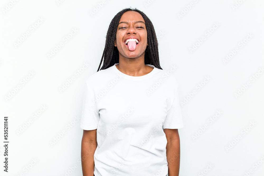 Young African American woman isolated on white background funny and friendly sticking out tongue. Young African American woman isolated on white background funny and friendly sticking out tongue.