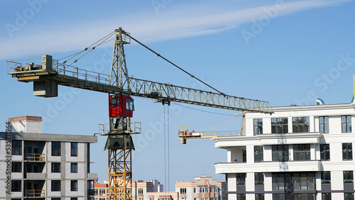 View from a height of the construction site, modern construction of new residential complexes in a small town
