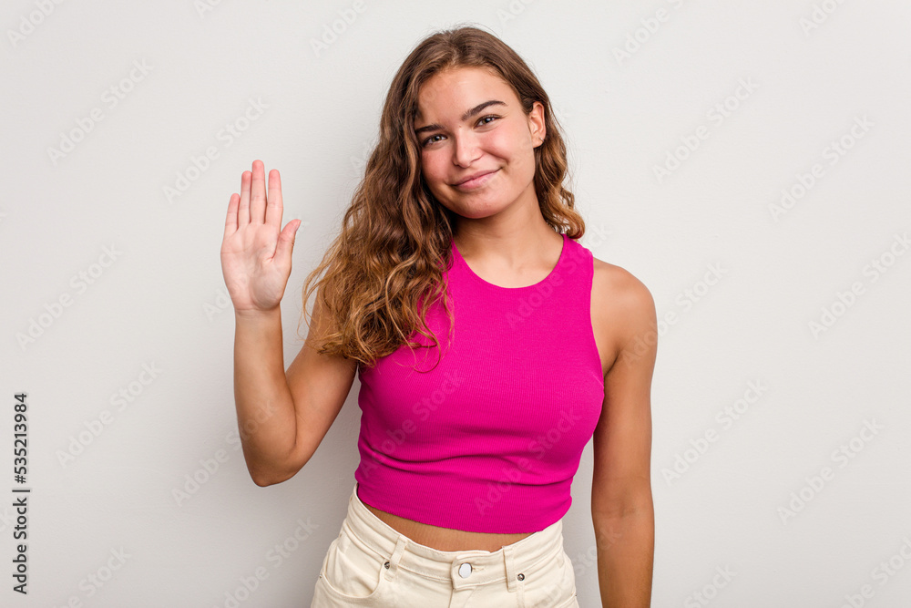 Young caucasian woman isolated on blue background smiling cheerful showing number five with fingers. Young caucasian woman isolated on blue background smiling cheerful showing number five with fingers.