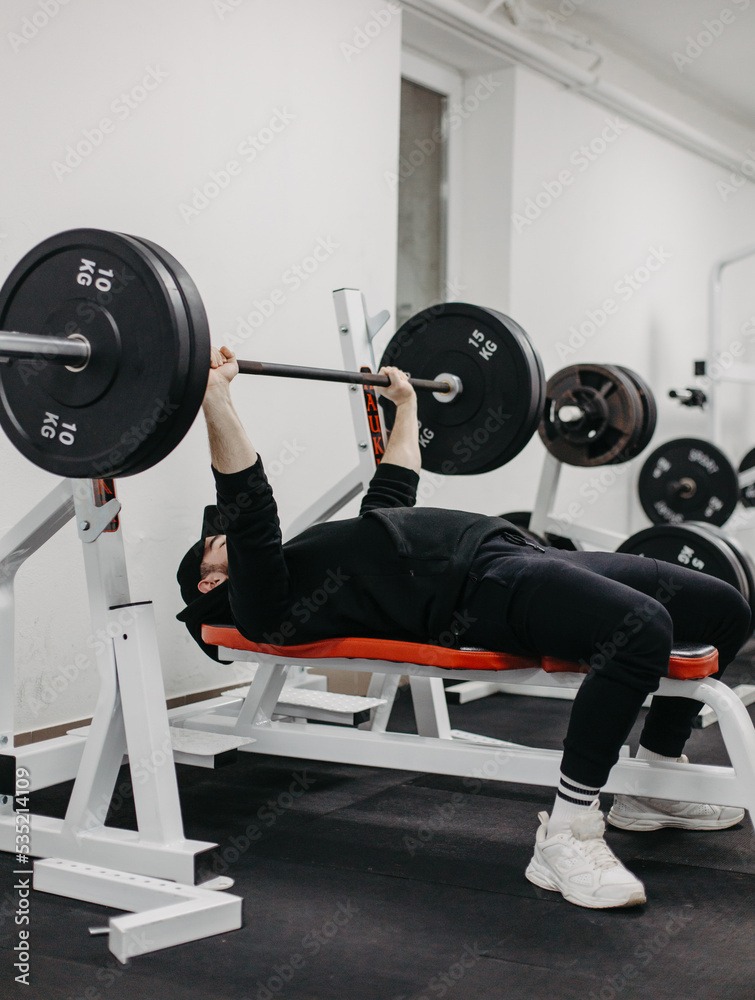 Young man trains his body to stay fit and have defined muscles. Young man trains his body to stay fit and have defined muscles.