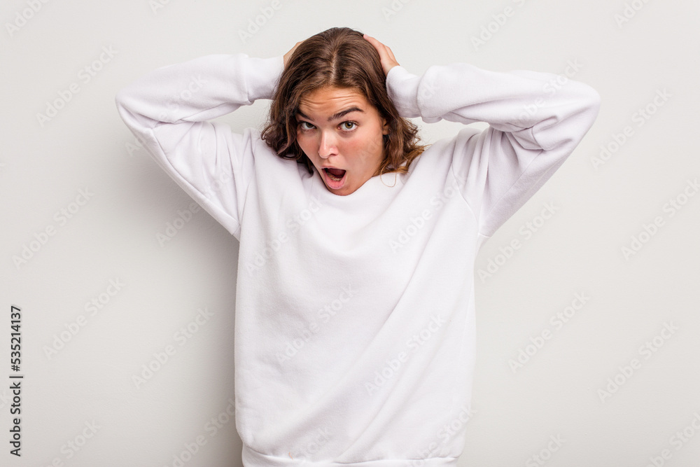 Young caucasian woman isolated on blue background screaming, very excited, passionate, satisfied with something. Young caucasian woman isolated on blue background screaming, very excited, passionate, satisfied with something.