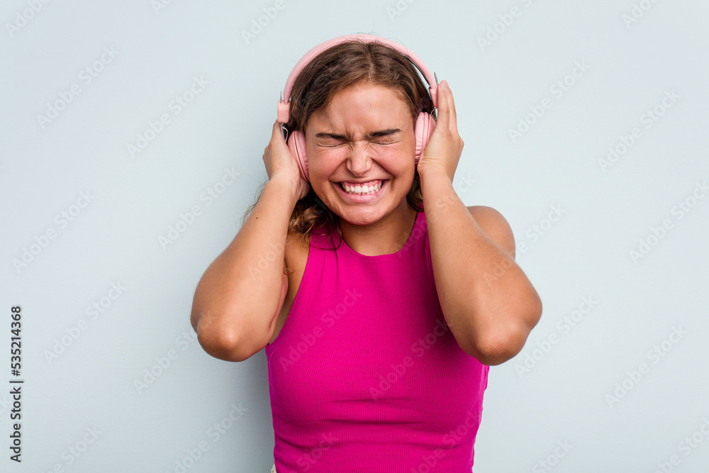 covering ears with hands. covering ears with hands.