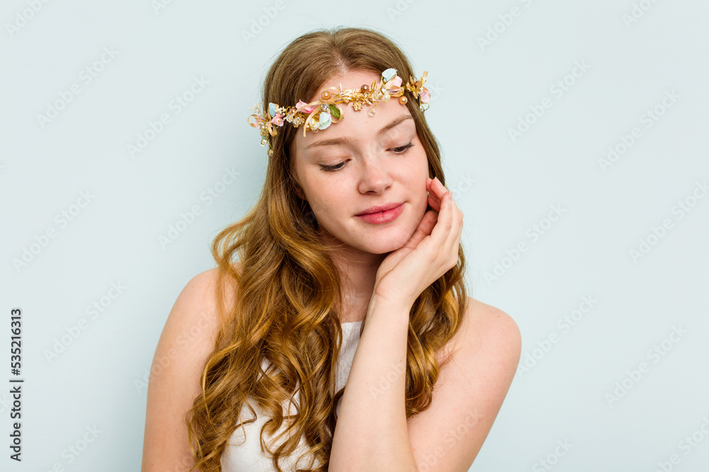 Young elf woman isolated on blue background Young elf woman isolated on blue background