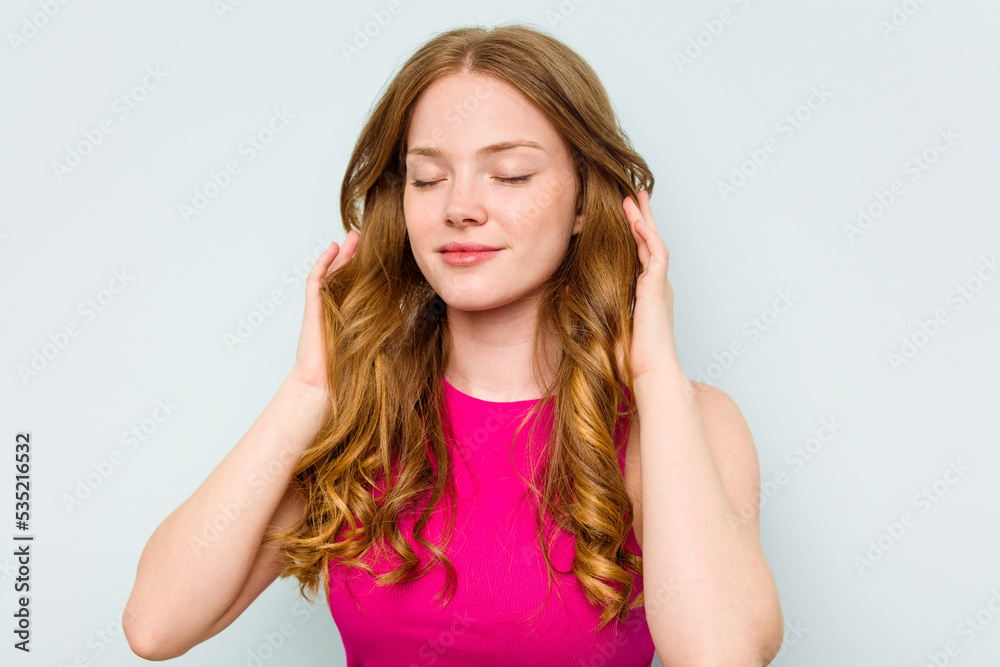 Portrait of pretty young caucasian woman isolated on blue background Portrait of pretty young caucasian woman isolated on blue background