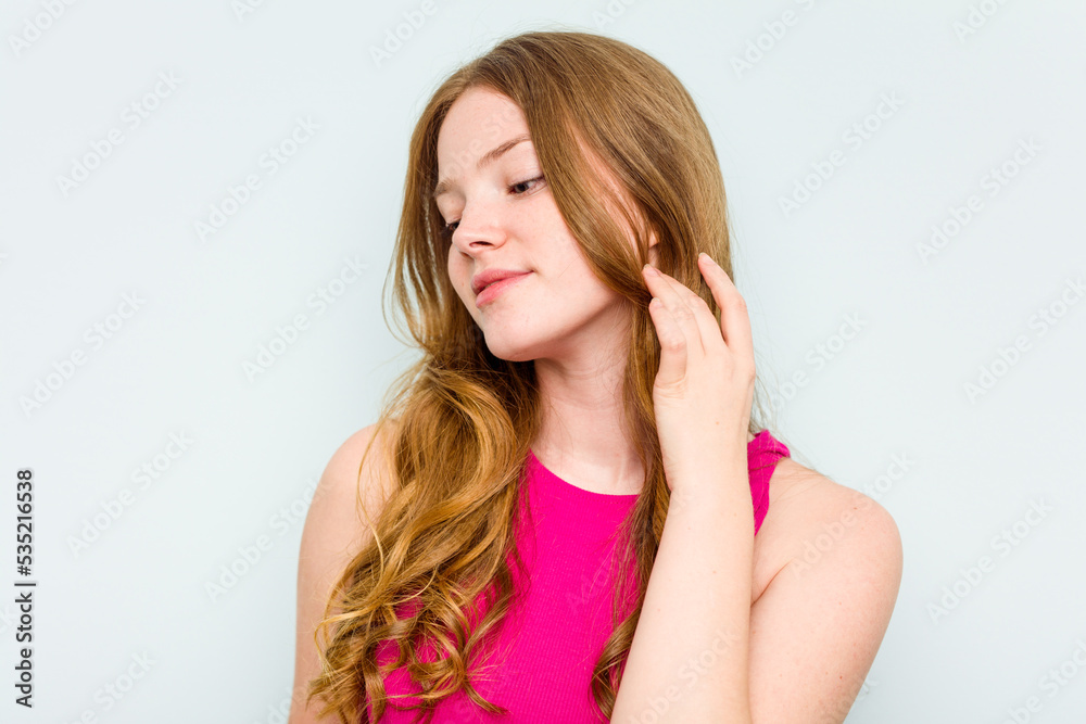 Portrait of pretty young caucasian woman isolated on blue background Portrait of pretty young caucasian woman isolated on blue background
