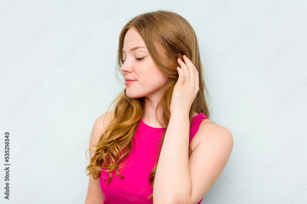 Portrait of pretty young caucasian woman isolated on blue background Portrait of pretty young caucasian woman isolated on blue background