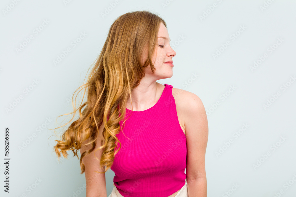 Portrait of pretty young caucasian woman isolated on blue background Portrait of pretty young caucasian woman isolated on blue background