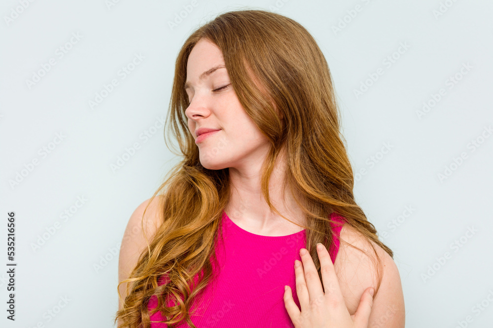 Portrait of pretty young caucasian woman isolated on blue background Portrait of pretty young caucasian woman isolated on blue background