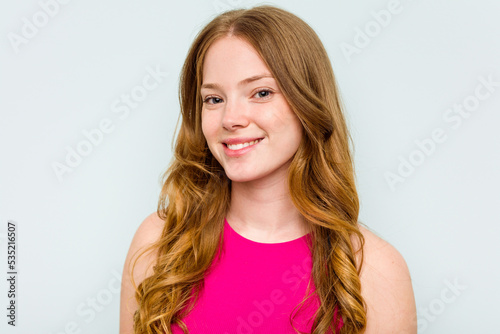 Portrait of pretty young caucasian woman isolated on blue background