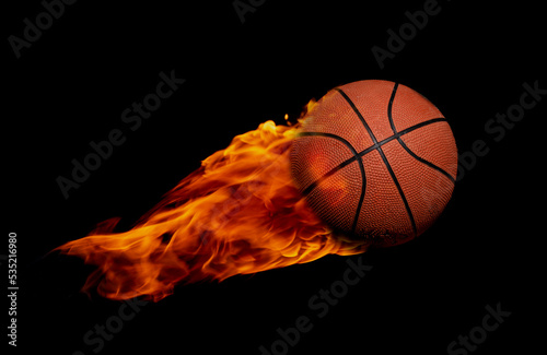 Basketball through flame of fire - sports and competition concept