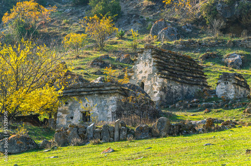 The city of the dead in North Ossetia. An ancient necropolis high in the mountains. A complex of ground and semi-underground structures-crypts. Ancient stone buildings in an ancient city. Ancient city