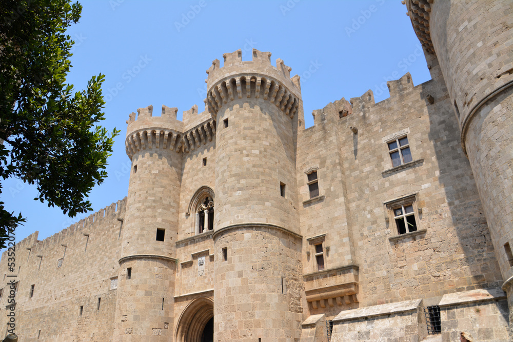 medieval castle on greek rhodes island with blue sky on background, front view