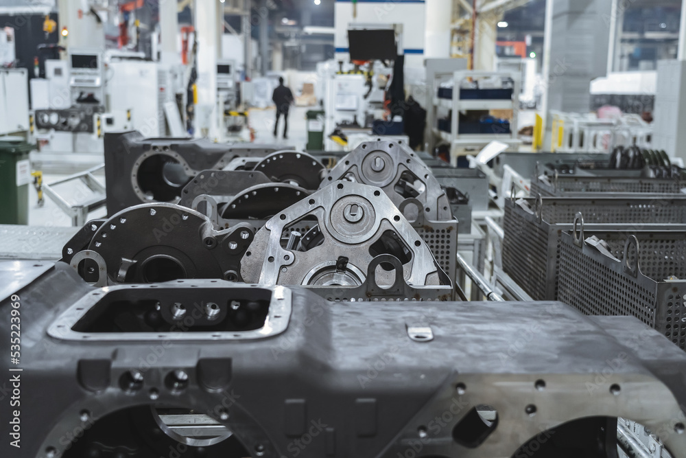 Production of transmissions for agricultural machinery at modern industrial plant or factory close-up. Production of transmissions for agricultural machinery at modern industrial plant or factory close-up.