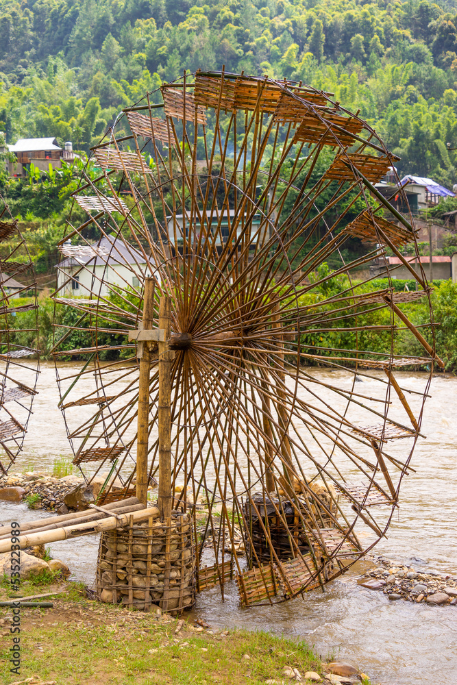Fototapeta premium view of Water mill in Mu Cang Chai, Yen Bai province, Vietnam in a summer day