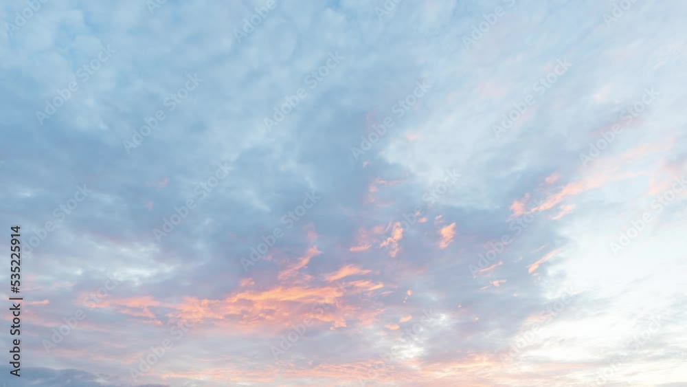 The sky is in gentle shades of orange and red. Fairytale dramatic sky at sunset.