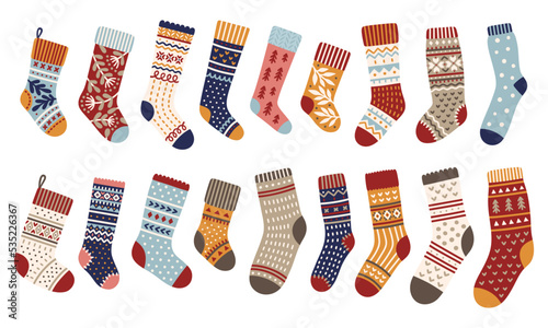 Christmas knitted socks set. Collection of cozy woolen winter accessories. Vector illustration