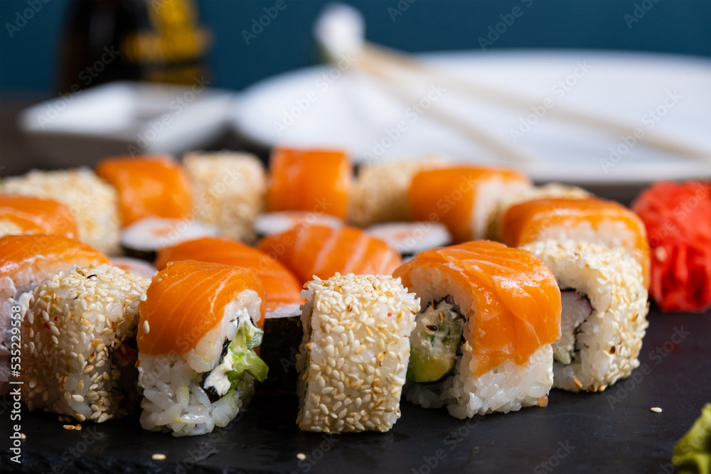 Sushi set close-up on black board. Traditional Japanese seafood Sushi set close-up on black board. Traditional Japanese seafood