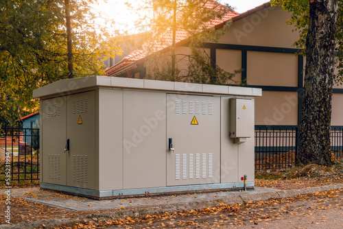 Outdoor electric high voltage distribution cabinet in a town