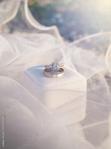 Wedding accessories. Diamondengagement wedding rings on white box. Valentine's day and Wedding day concept. Love signal
