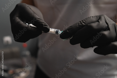 A close up of hands and blood draw process © Dusan