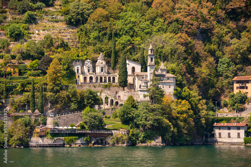 Beautiful panorama of lake Como with a small coastal town, famous tourism destination Beautiful panorama of lake Como with a small coastal town, famous tourism destination