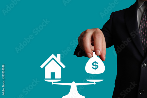 Mortgage. Purchase of real estate or property. Weighting bag of money (value) and property.
