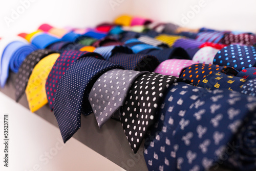 ties on hangers in men clothing store