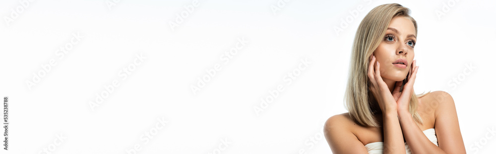 portrait of blonde woman with blue eyes and bare shoulders looking away isolated on white, banner. portrait of blonde woman with blue eyes and bare shoulders looking away isolated on white, banner.