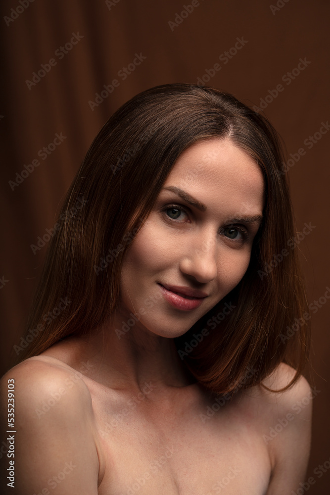 portrait of a young attractive woman on a dark background portrait of a young attractive woman on a dark background