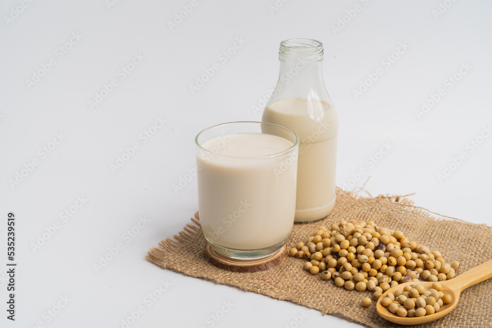 Health Benefits of Soy Milk,Soy milk in glass and soya bean isolated on white background Health Benefits of Soy Milk,Soy milk in glass and soya bean isolated on white background