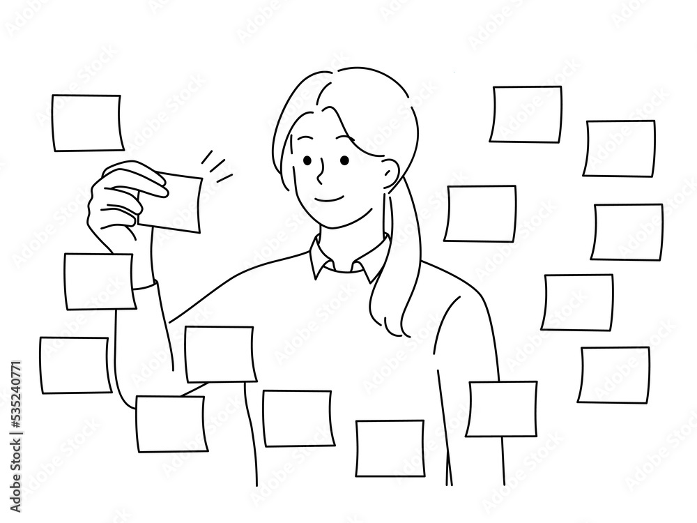 Businesswoman work with sticky notes on board 