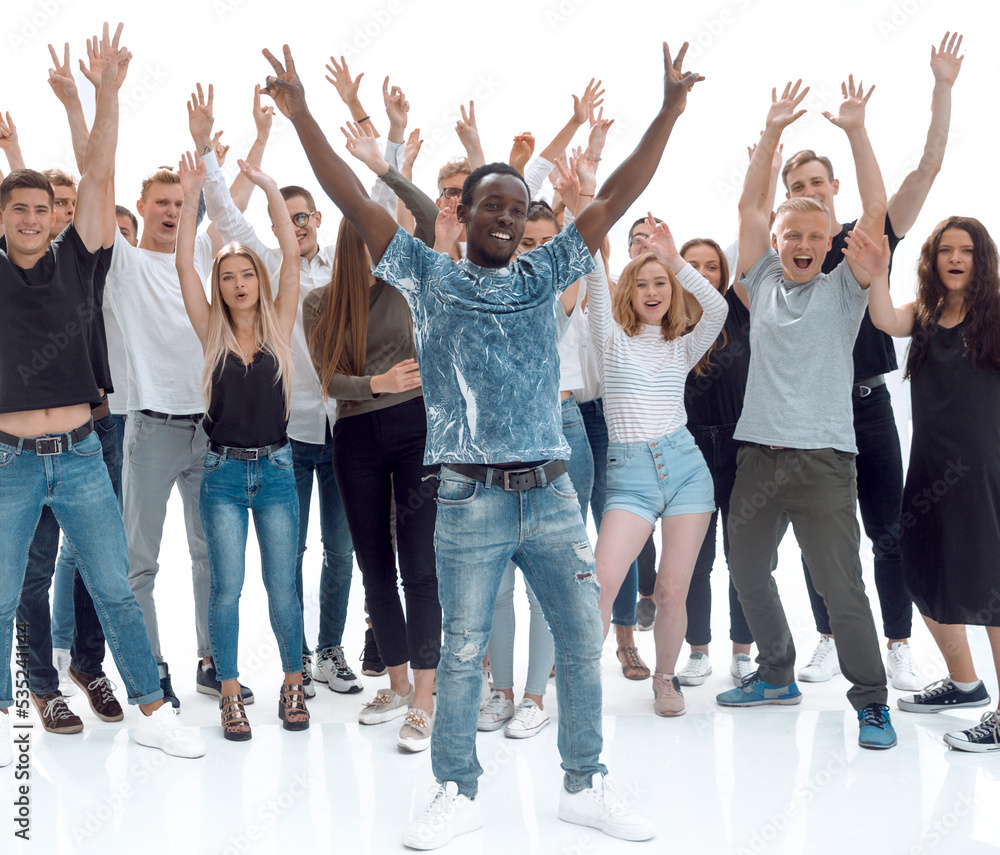 in full growth. a triumphant team of diverse young people in full growth. a triumphant team of diverse young people
