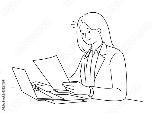 Successful businesswoman work on laptop with paperwork 
