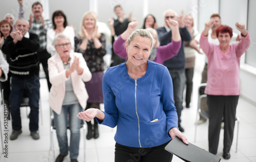 Businesswoman addressing colleagues at office meeting