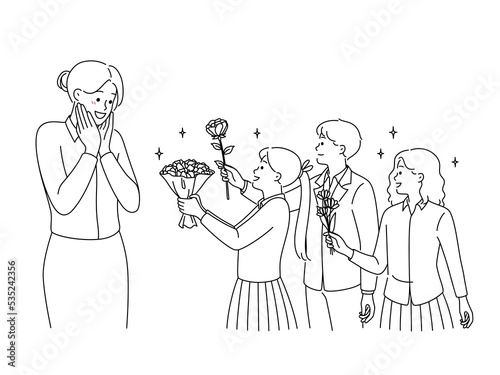 Children in uniform greeting happy teacher 