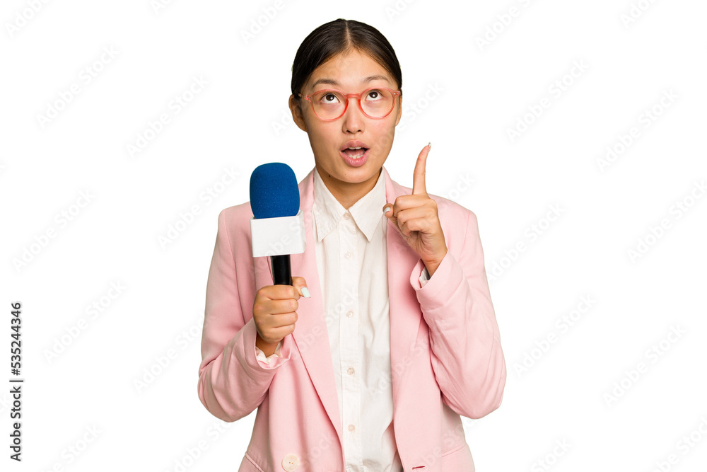 Young TV Asian presenter isolated on green chroma background pointing upside with opened mouth. Young TV Asian presenter isolated on green chroma background pointing upside with opened mouth.