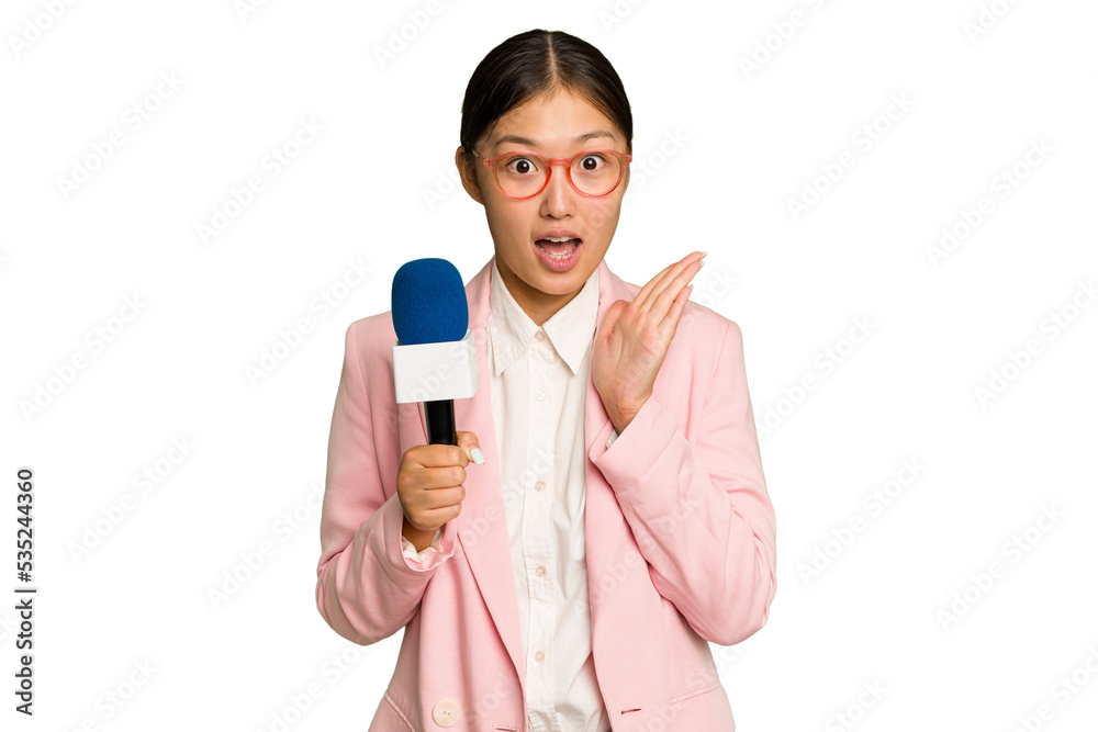 Young TV Asian presenter isolated on green chroma background surprised and shocked. Young TV Asian presenter isolated on green chroma background surprised and shocked.