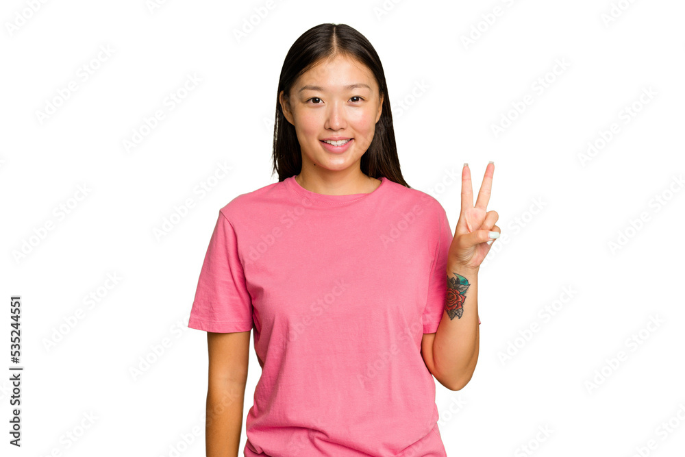 Young Asian woman isolated on green chroma background showing victory sign and smiling broadly. Young Asian woman isolated on green chroma background showing victory sign and smiling broadly.