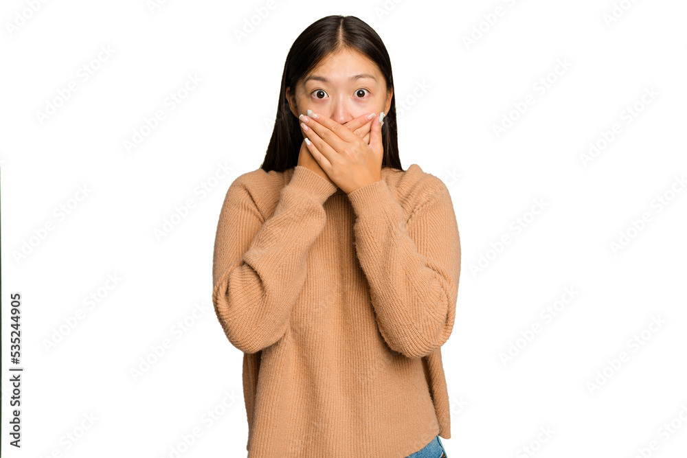 Young Asian woman isolated on green chroma background covering mouth with hands looking worried. Young Asian woman isolated on green chroma background covering mouth with hands looking worried.