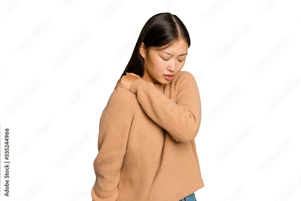 Young Asian woman isolated on green chroma background having a shoulder pain. Young Asian woman isolated on green chroma background having a shoulder pain.