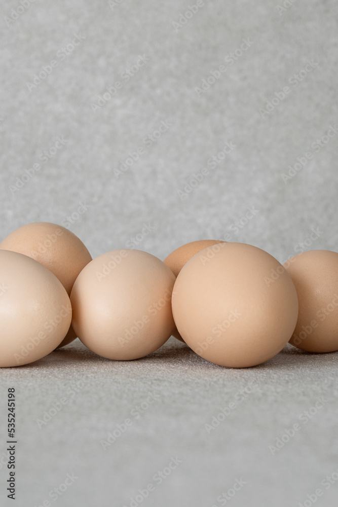 group of chicken eggs on a gray background with copy space group of chicken eggs on a gray background with copy space