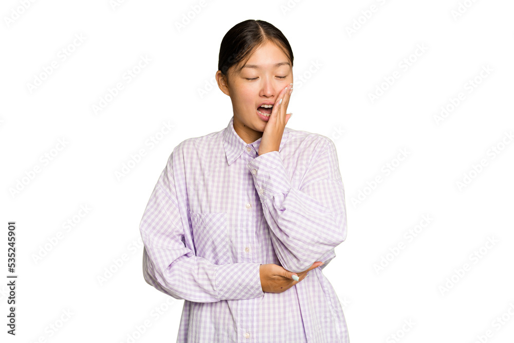 Young Asian woman isolated on green chroma background yawning showing a tired gesture covering mouth with hand. Young Asian woman isolated on green chroma background yawning showing a tired gesture covering mouth with hand.